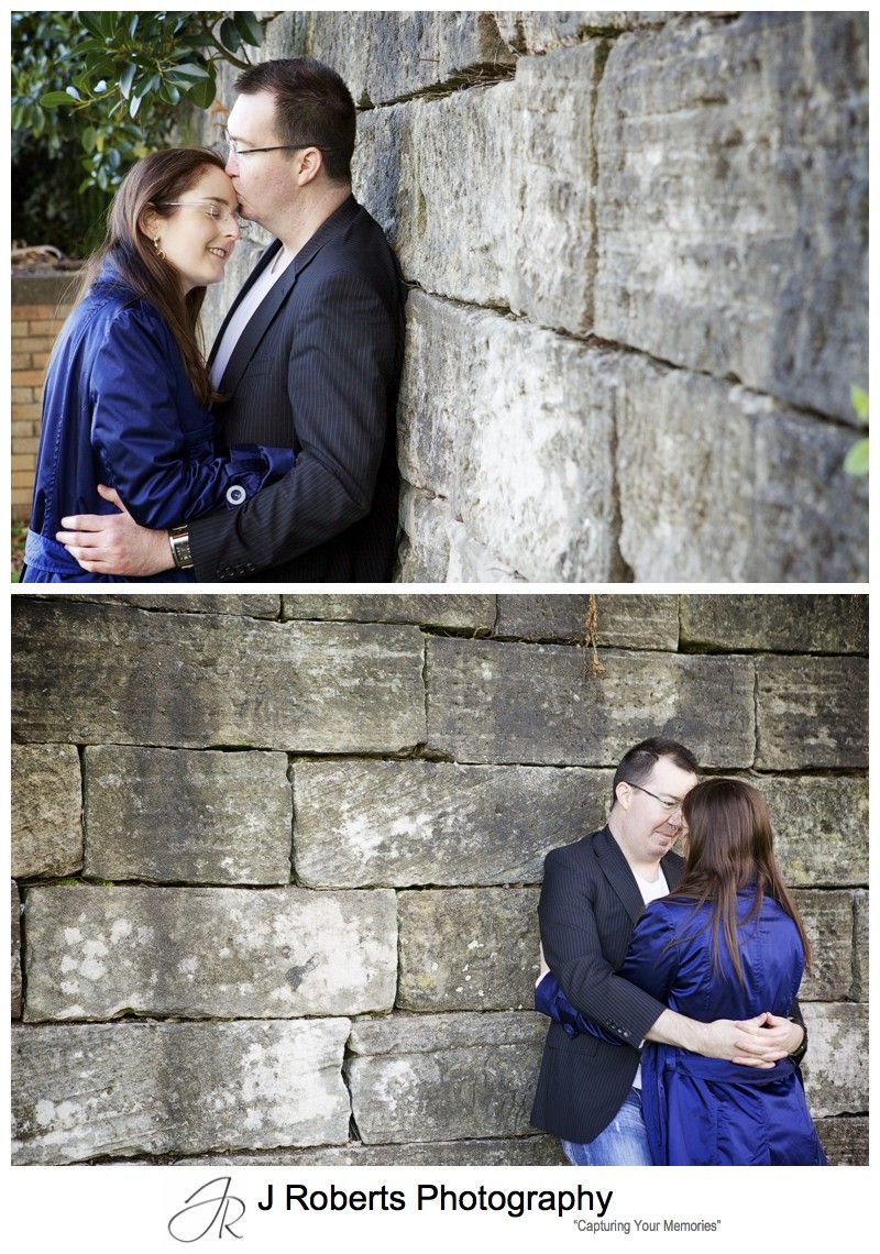 Portraits of an engaged couple with sandstone wall - engagement portraits sydney